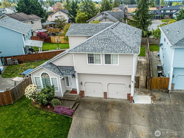 14231 SE 282nd St, Kent, WA 98042 - view of front facade with a front lawn, a residential view, an attached garage, driveway, and roof with shingles