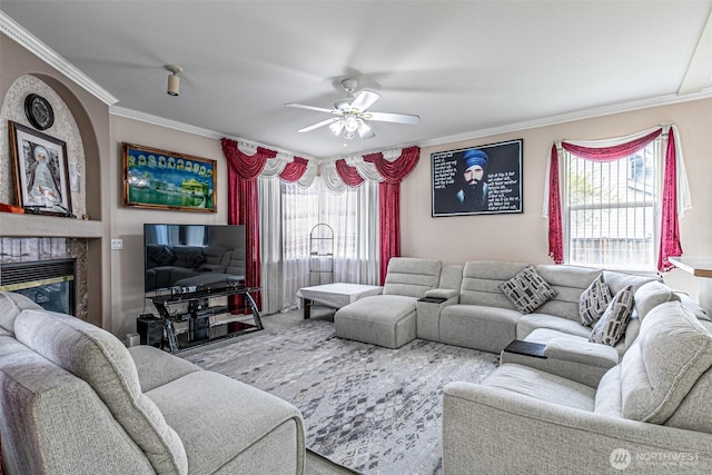 14231 SE 282nd St, Kent, WA 98042 - living area featuring a glass covered fireplace, ornamental molding, and ceiling fan