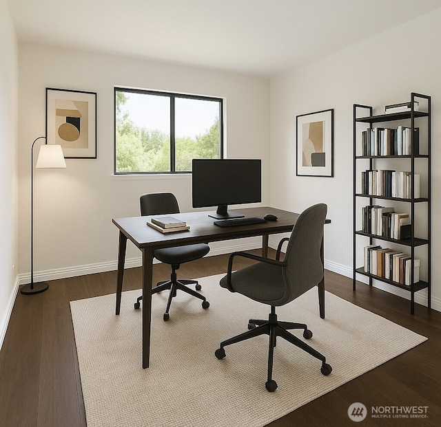 office area featuring baseboards and dark wood finished floors