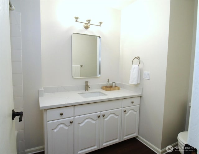bathroom with vanity and toilet