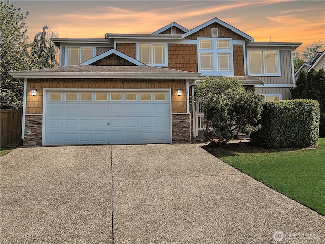 view of front of house with stone siding and concrete driveway