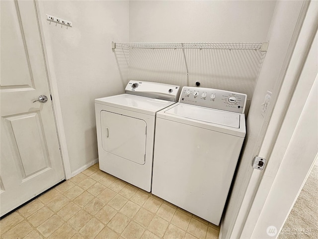 washroom with laundry area and washer and clothes dryer