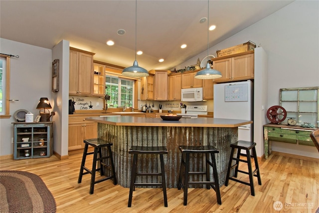 25012 67th Ave E, Graham, WA 98338 - kitchen featuring recessed lighting, white appliances, light wood-type flooring, a kitchen island, and decorative light fixtures