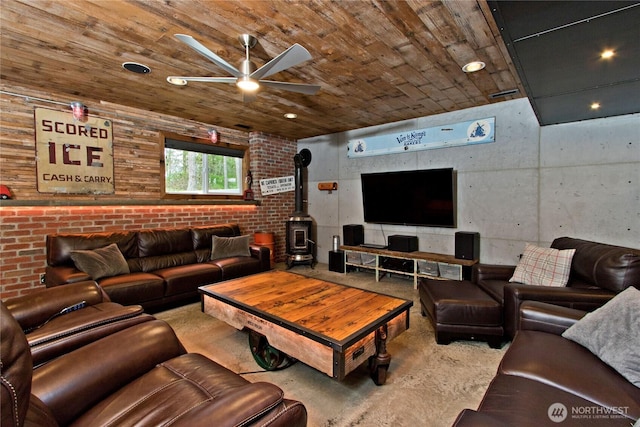 25012 67th Ave E, Graham, WA 98338 - living room featuring wood ceiling, a ceiling fan, concrete floors, and a wood stove