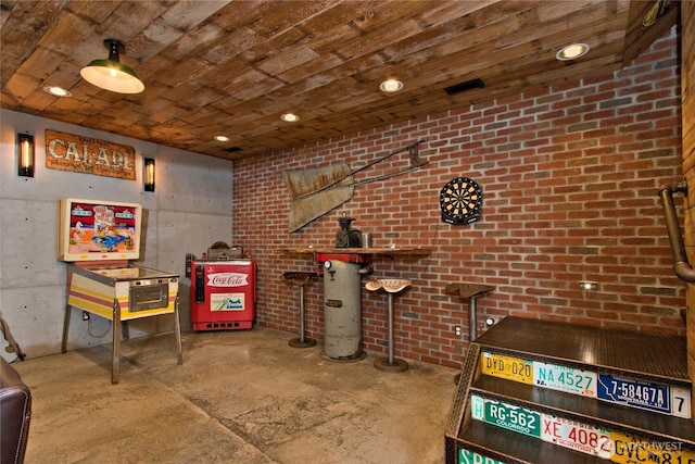 25012 67th Ave E, Graham, WA 98338 - playroom with wood ceiling, brick wall, and unfinished concrete floors