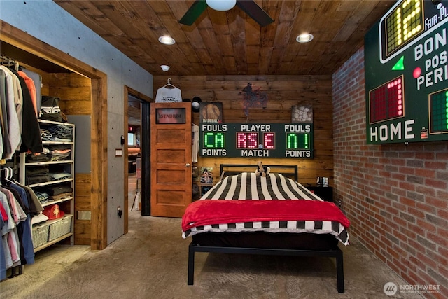 25012 67th Ave E, Graham, WA 98338 - bedroom featuring unfinished concrete floors, wooden ceiling, and wood walls