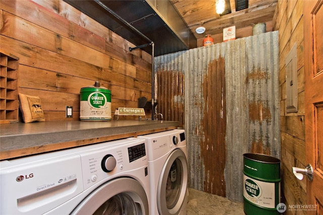 25012 67th Ave E, Graham, WA 98338 - washroom featuring wooden walls, visible vents, and washer and clothes dryer