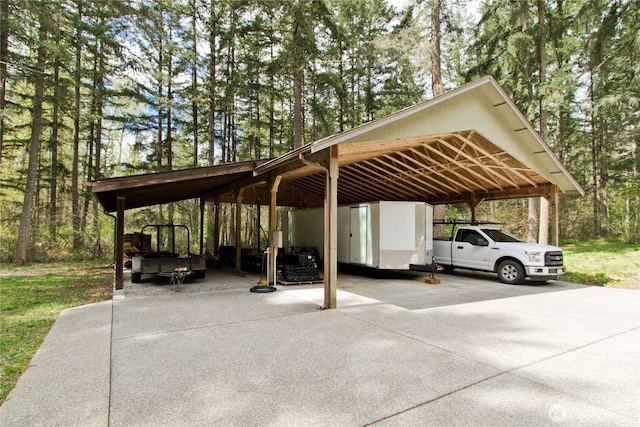 25012 67th Ave E, Graham, WA 98338 - view of parking / parking lot featuring a detached carport and driveway