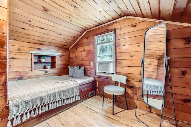bedroom featuring wooden ceiling, cooling unit, lofted ceiling, wooden walls, and hardwood / wood-style floors