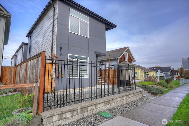 2420 S I St Unit 12, Tacoma, WA 98405 - exterior space with a fenced front yard