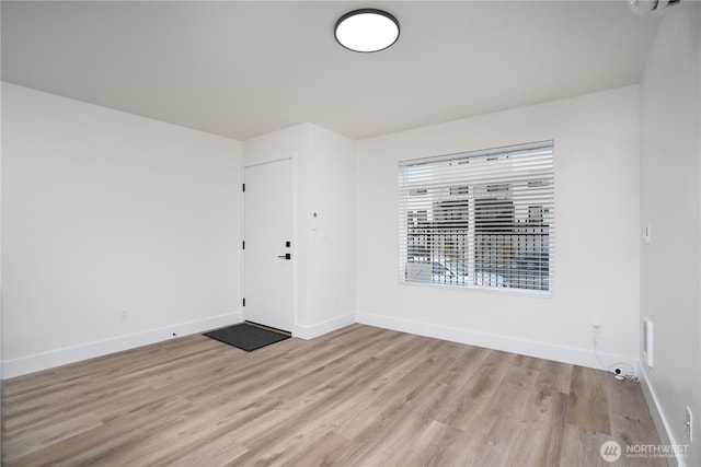 2420 S I St Unit 12, Tacoma, WA 98405 - empty room with light wood-type flooring and baseboards