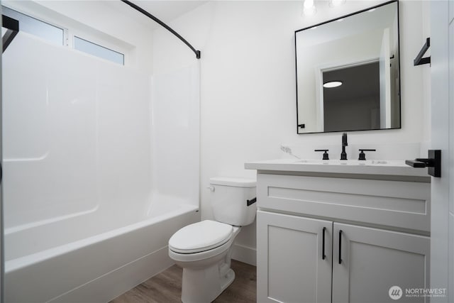2420 S I St Unit 12, Tacoma, WA 98405 - full bathroom with washtub / shower combination, wood finished floors, toilet, and vanity