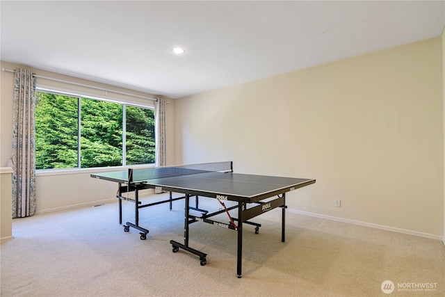 recreation room featuring recessed lighting, baseboards, and light carpet