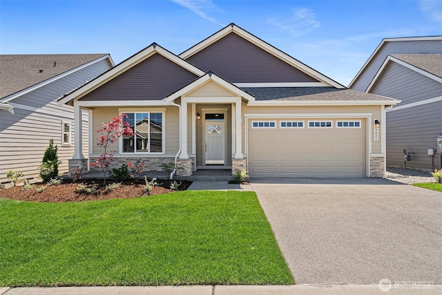 9621 7th Ave SE, Lacey, WA 98513 - craftsman-style home featuring an attached garage, stone siding, concrete driveway, a front lawn, and roof with shingles