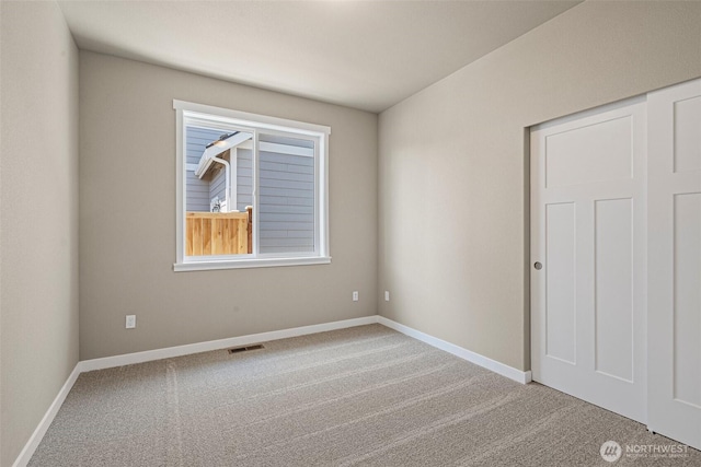 9621 7th Ave SE, Lacey, WA 98513 - empty room featuring carpet floors and baseboards