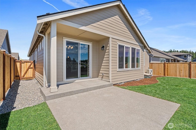 9621 7th Ave SE, Lacey, WA 98513 - rear view of house with a patio, a fenced backyard, and a gate
