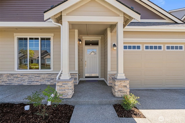 9621 7th Ave SE, Lacey, WA 98513 - property entrance with a garage and stone siding