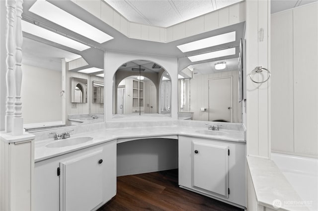 bathroom with vanity and wood finished floors