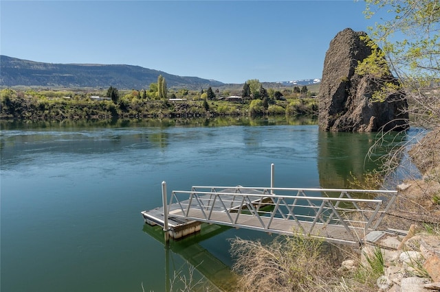 dock area featuring a water and mountain view