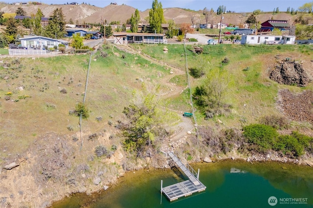 drone / aerial view with a water and mountain view