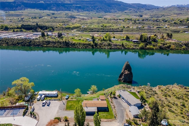 drone / aerial view with a water and mountain view