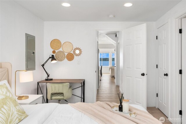 bedroom featuring recessed lighting and electric panel