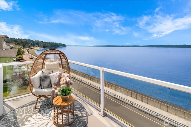 balcony featuring a water view