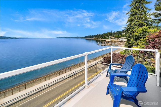 balcony featuring a water view