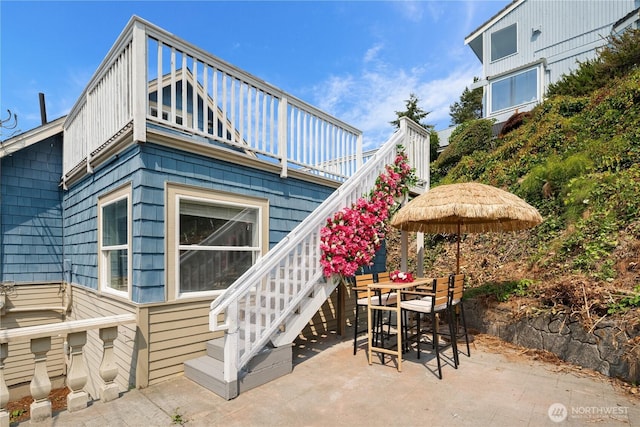 exterior space featuring a patio and stairs