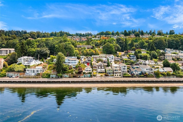 birds eye view of property featuring a water view