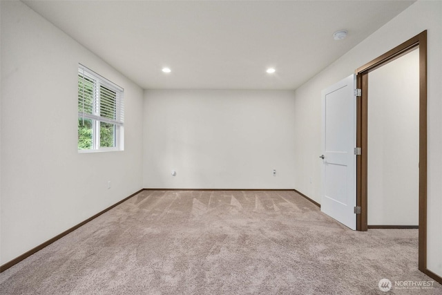 empty room with recessed lighting, carpet floors, and baseboards