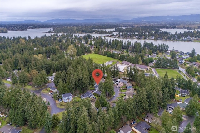 bird's eye view featuring a water and mountain view and a residential view