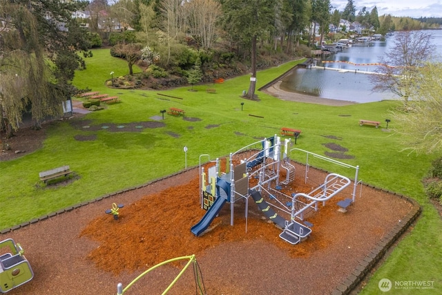 community jungle gym featuring a yard and a water view