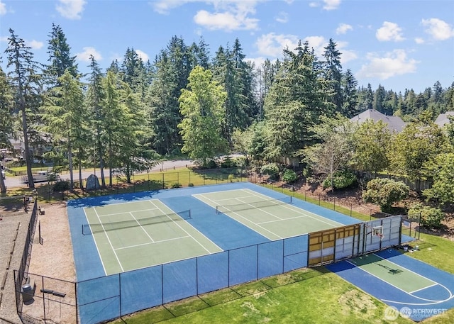 view of sport court featuring fence