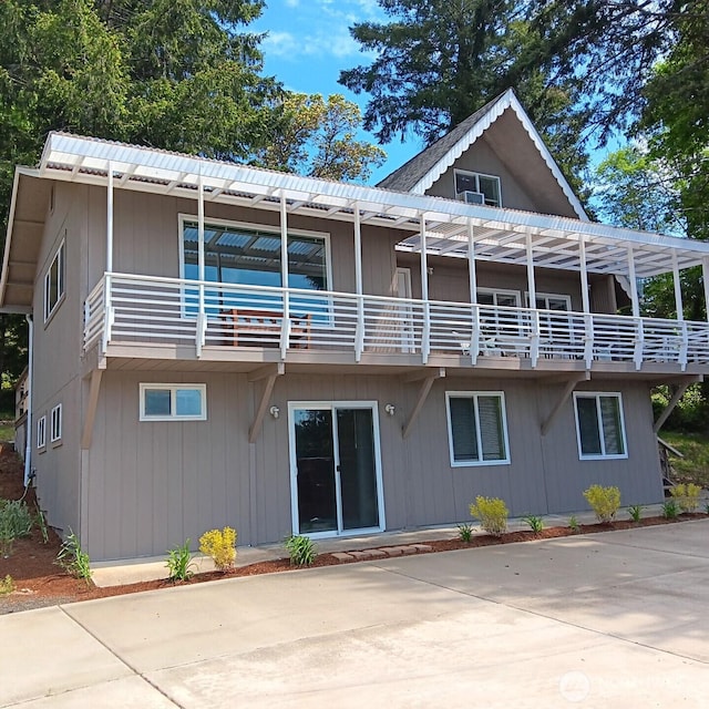 back of property featuring a balcony