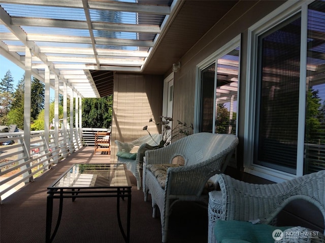 balcony with a pergola and outdoor lounge area