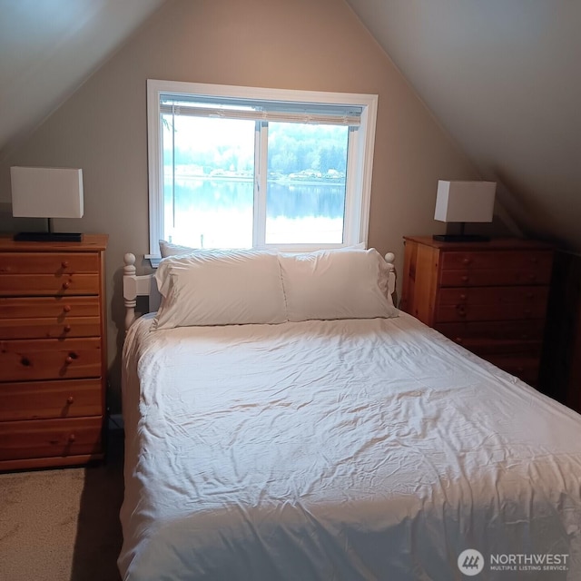 bedroom with carpet flooring and vaulted ceiling