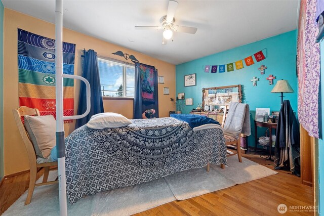 bedroom featuring ceiling fan and wood finished floors