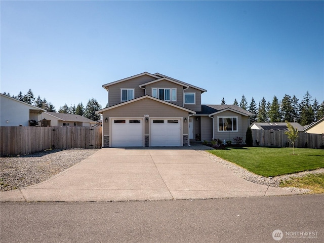 806 Cody St SE, Rainier, WA 98576 - traditional-style house featuring driveway, stone siding, and an attached garage