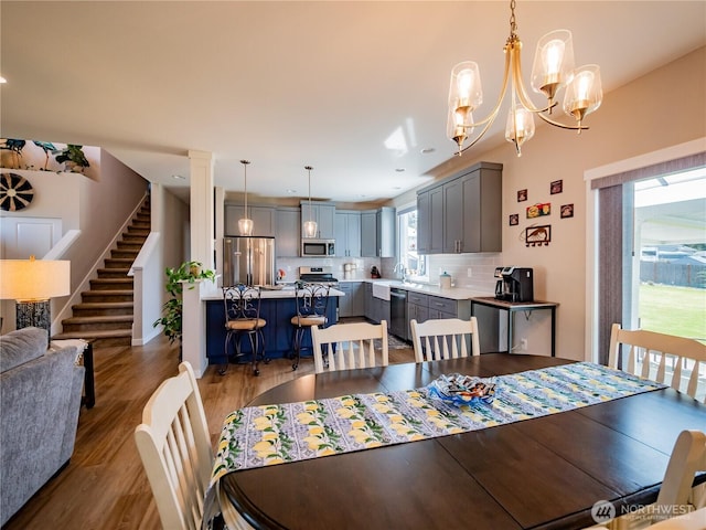 806 Cody St SE, Rainier, WA 98576 - dining room with light wood-style flooring, stairs, recessed lighting, and a chandelier