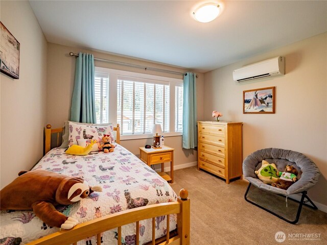 806 Cody St SE, Rainier, WA 98576 - bedroom with a wall unit AC, light colored carpet, and baseboards