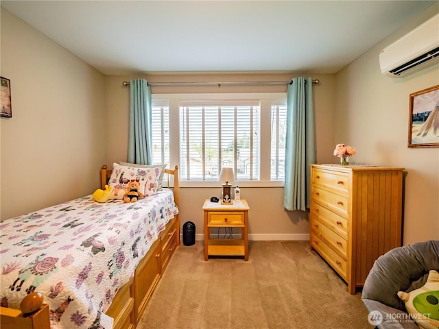806 Cody St SE, Rainier, WA 98576 - bedroom featuring a wall unit AC, light carpet, and baseboards