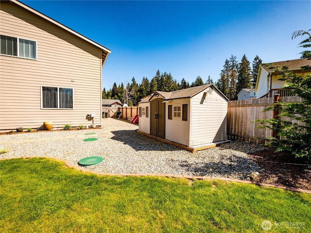 806 Cody St SE, Rainier, WA 98576 - view of yard featuring a storage unit and an outbuilding
