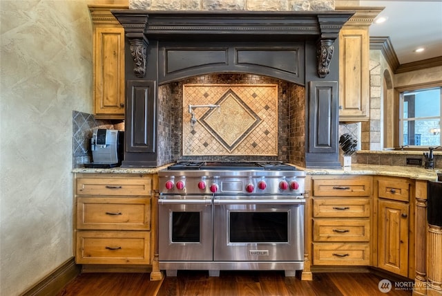 kitchen featuring dark wood-style floors, light stone countertops, tasteful backsplash, baseboards, and double oven range