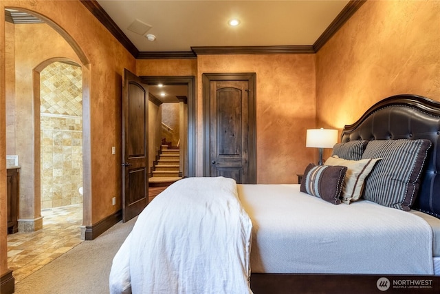 bedroom with baseboards and ornamental molding