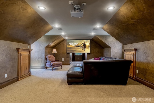carpeted home theater featuring recessed lighting and lofted ceiling