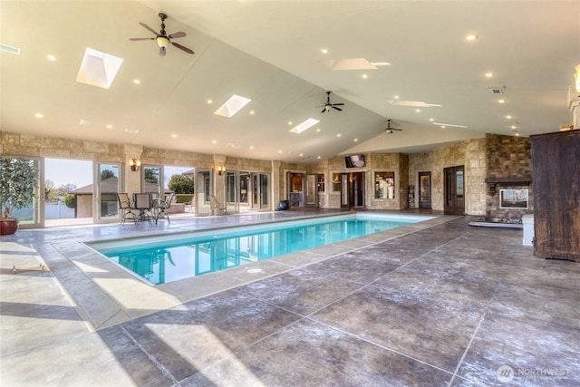 indoor pool featuring a ceiling fan