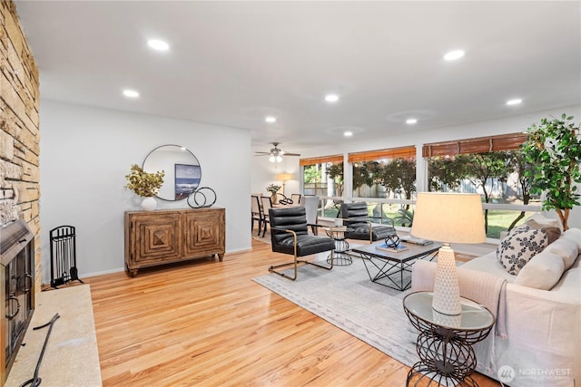 living room with baseboards, recessed lighting, wood finished floors, and ceiling fan