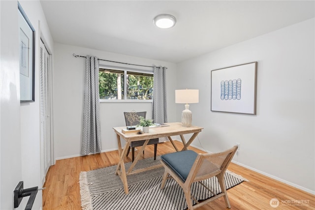 office featuring light wood finished floors and baseboards