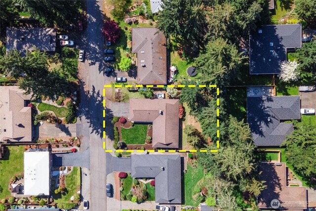 birds eye view of property with a residential view